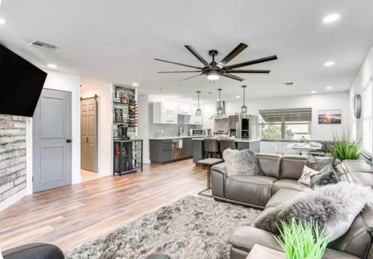Open concept living room and kitchen inside the Rain Rental Properties vacation home in Punta Gorda, Florida